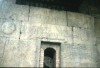 Area 4909: particolare della facciata principale del sepolcro dove sono visibili 'iscrizione e i due scudi rotondi ricavati nei blocchi
